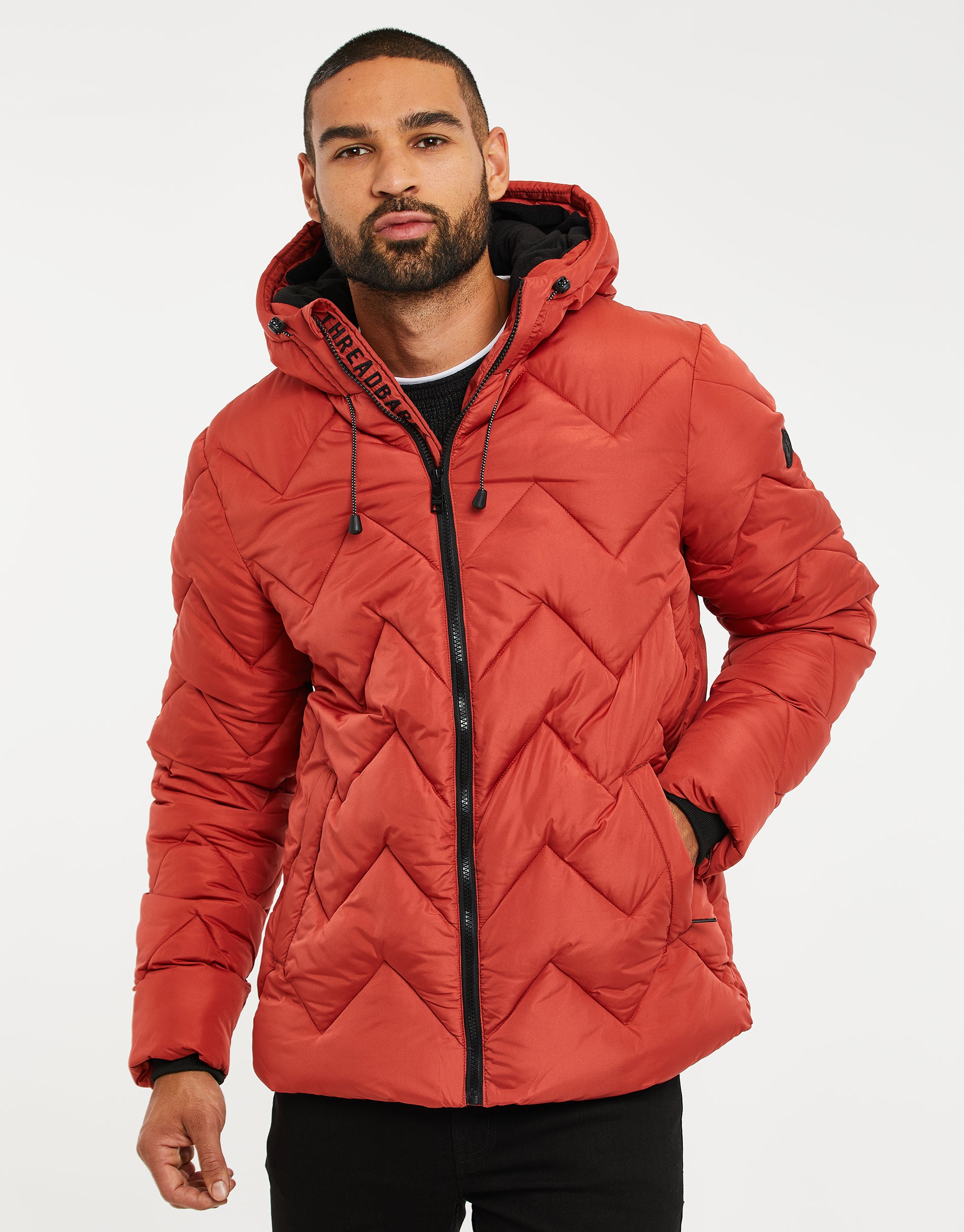 Zig Zag Quilted Jacket in Rust Orange