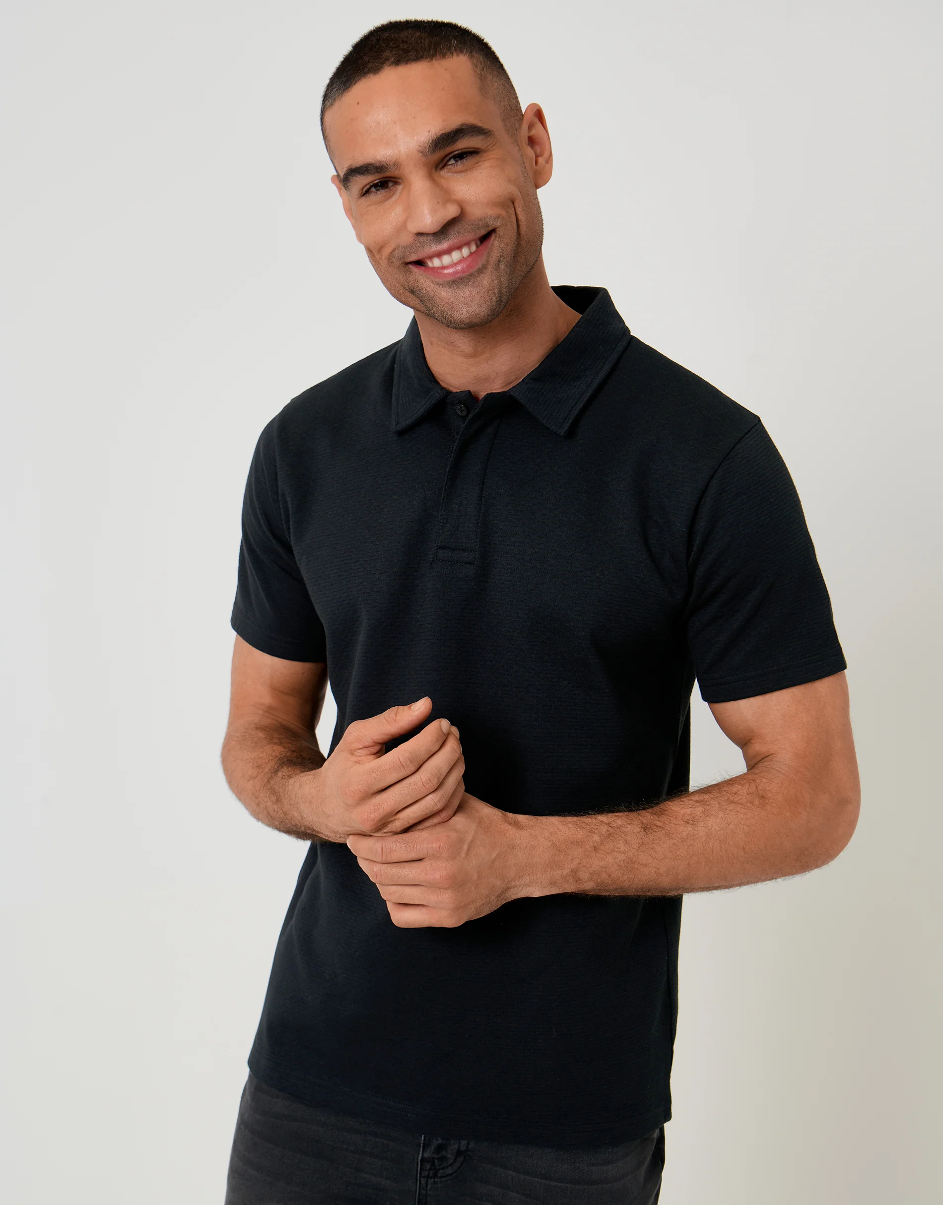 Textured Hidden Placket Polo Shirt in Black