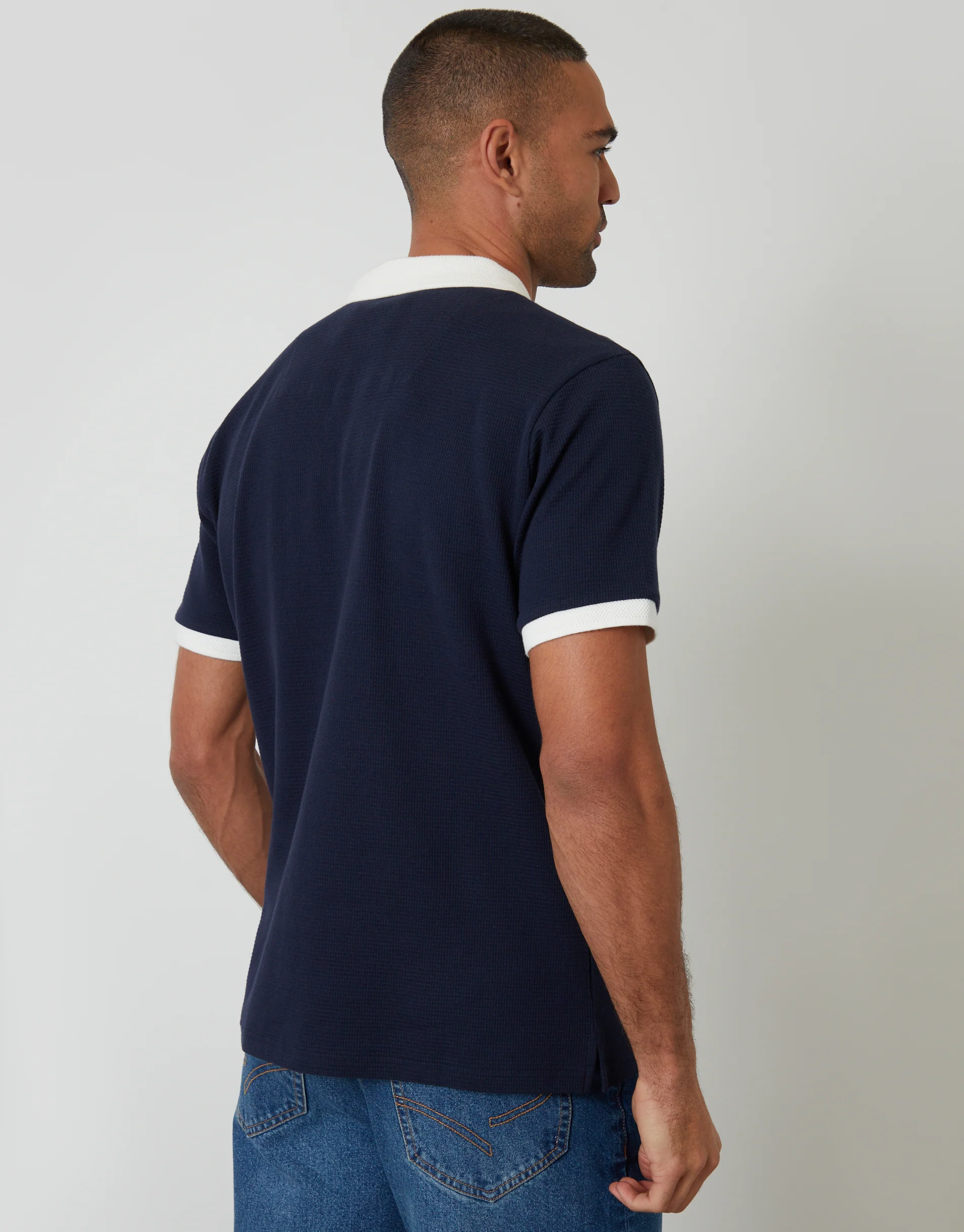 Trophy Neck Waffle Polo Shirt in Navy - Image 2