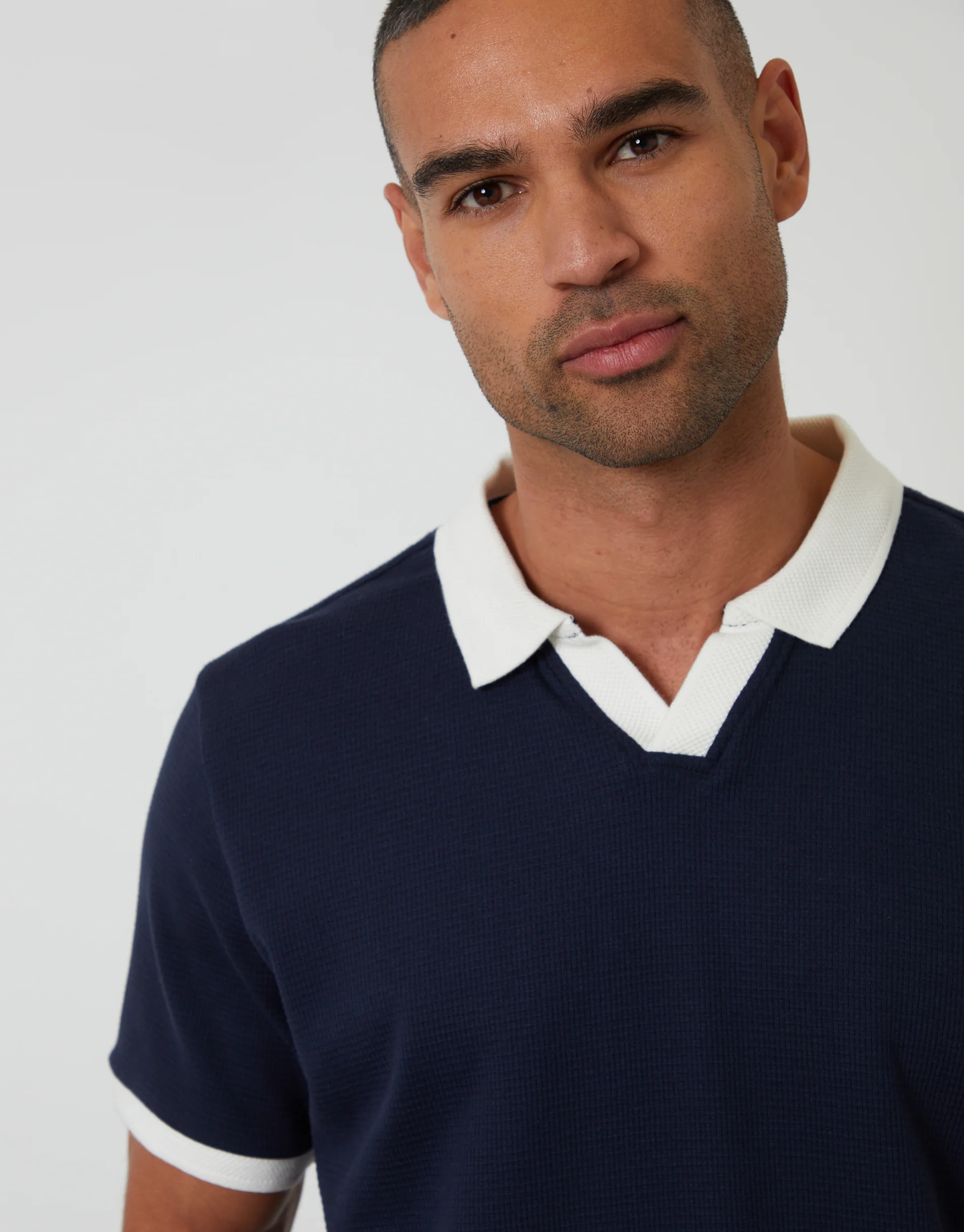Trophy Neck Waffle Polo Shirt in Navy - Image 4