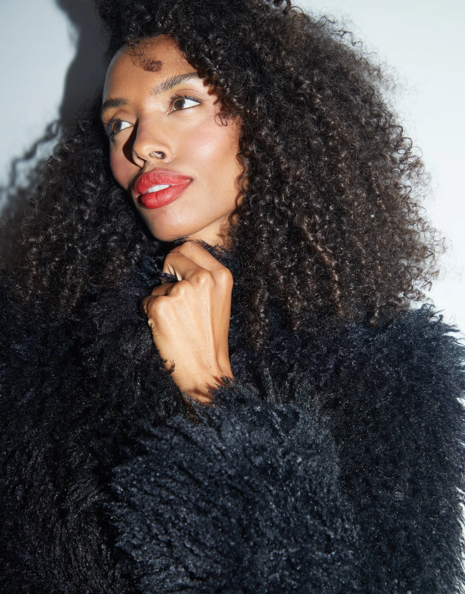 Mongolian Faux Fur Coat in Black - Image 4